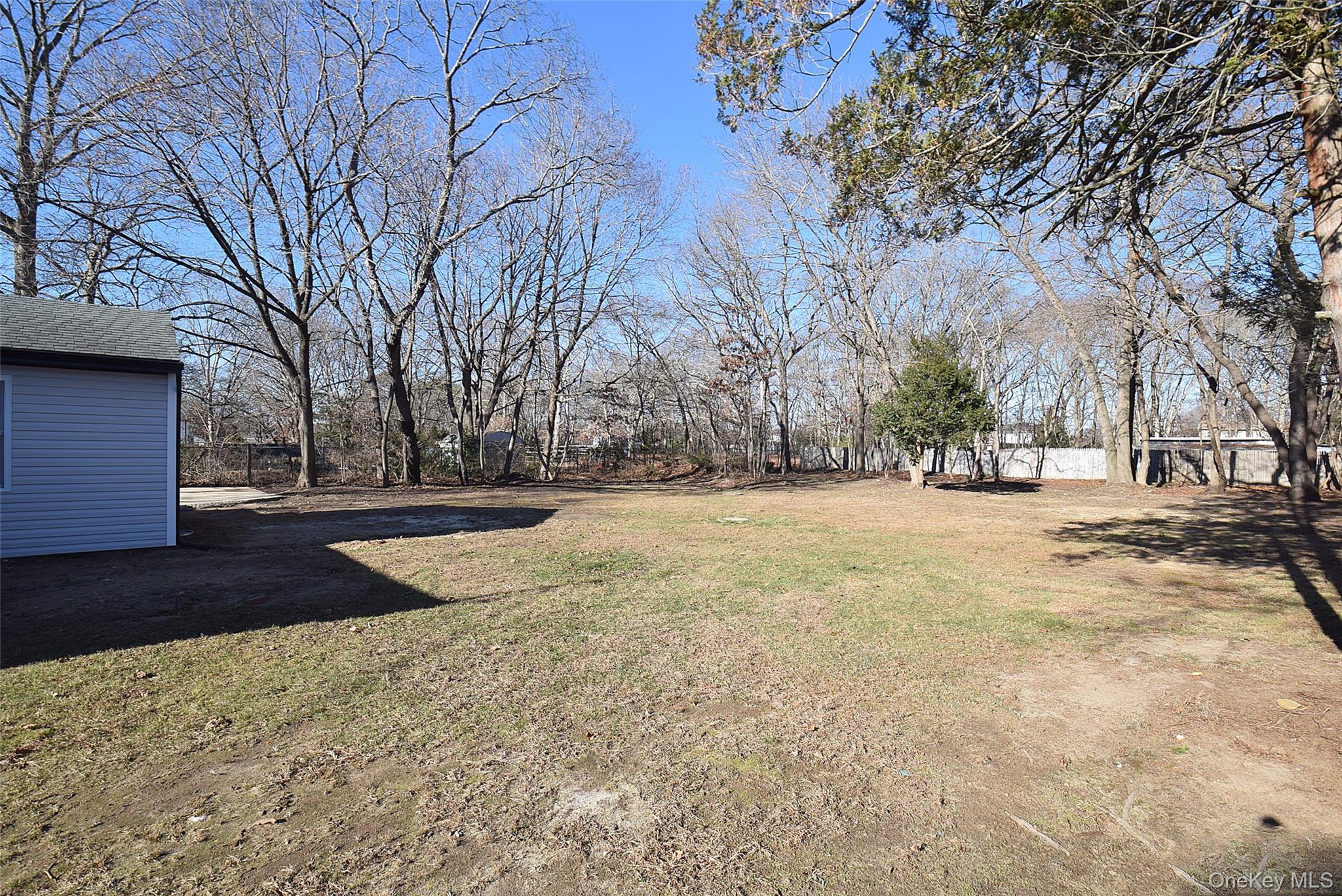 371 Oceanside Street Islip Terrace, NY 11752 - Photo 37 of 38 a view of yard covered with snow
