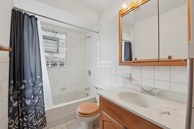 a bathroom with a sink a toilet and a bathtub