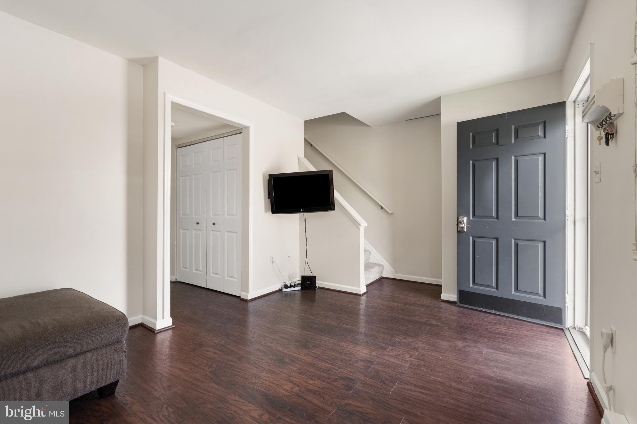 18 Wenner Drive Brunswick, MD 21716 - Photo 11 of 30 a view of an empty room with wooden floor and windows