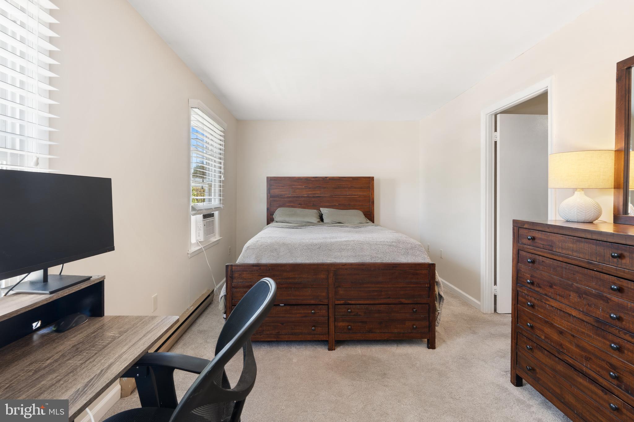 18 Wenner Drive Brunswick, MD 21716 - Photo 13 of 30 a bedroom with a bed and a flat screen tv