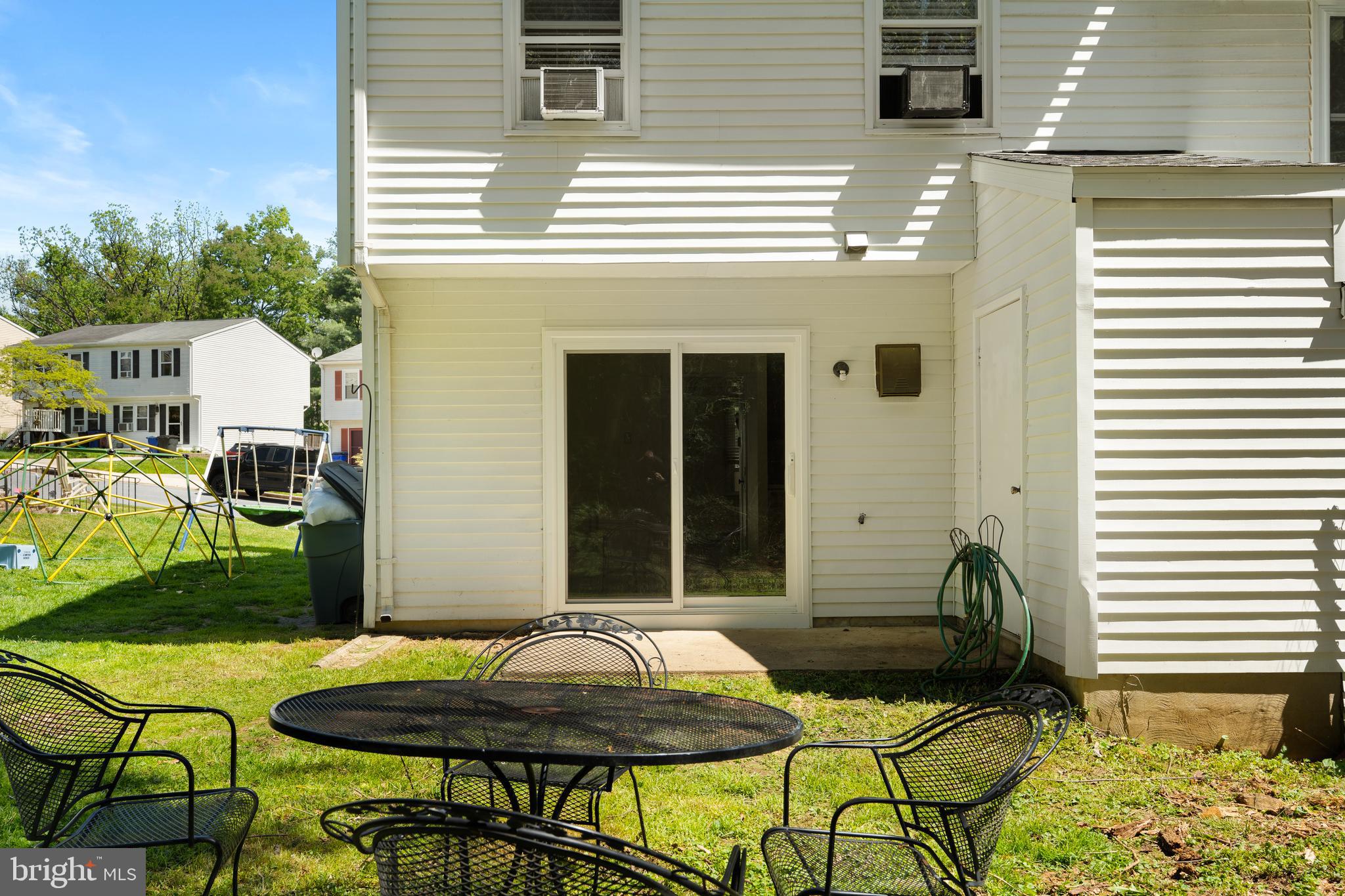 18 Wenner Drive Brunswick, MD 21716 - Photo 23 of 30 a backyard of a house with table and chairs