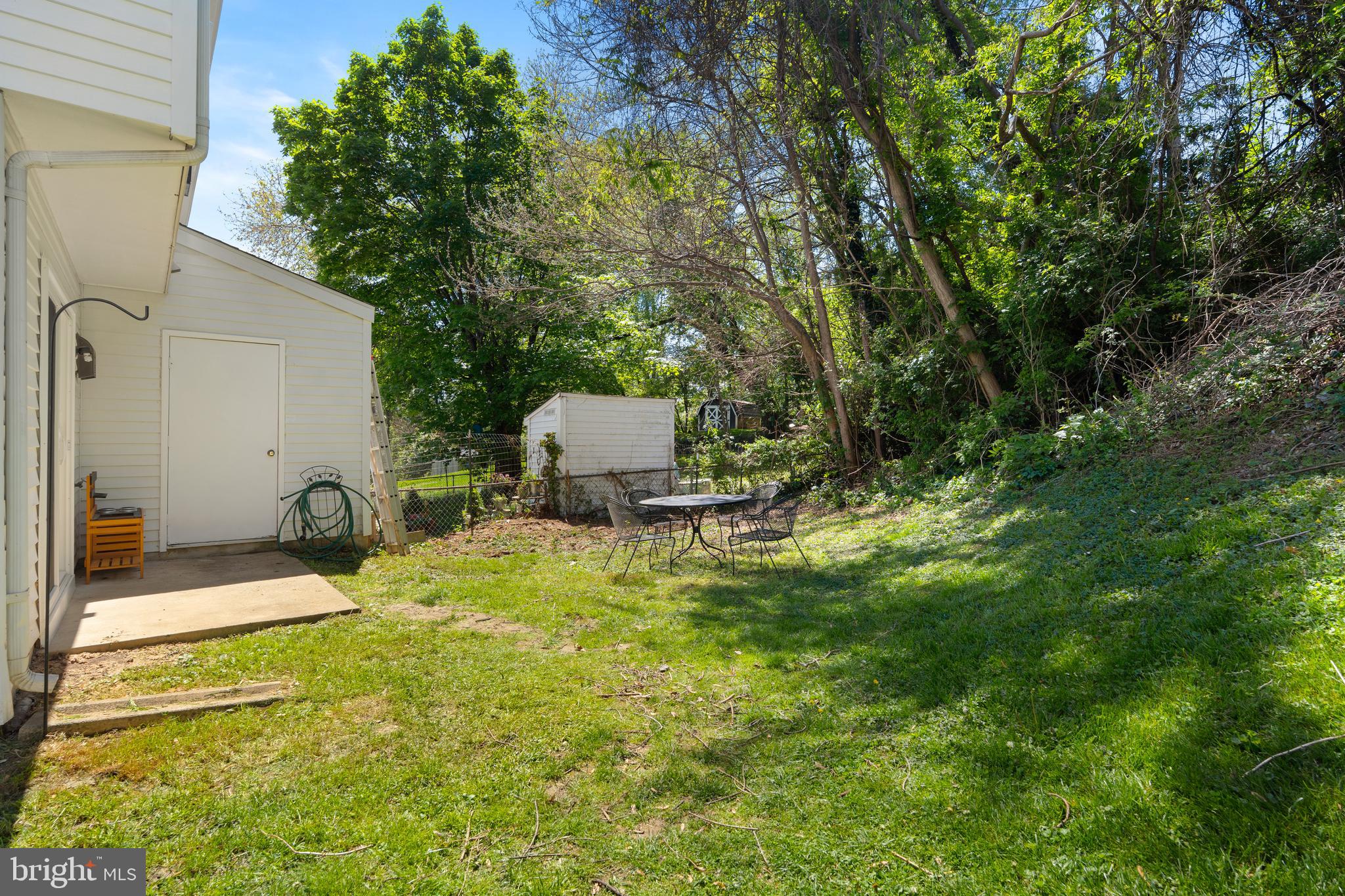 18 Wenner Drive Brunswick, MD 21716 - Photo 24 of 30 a backyard of a house with yard and outdoor seating