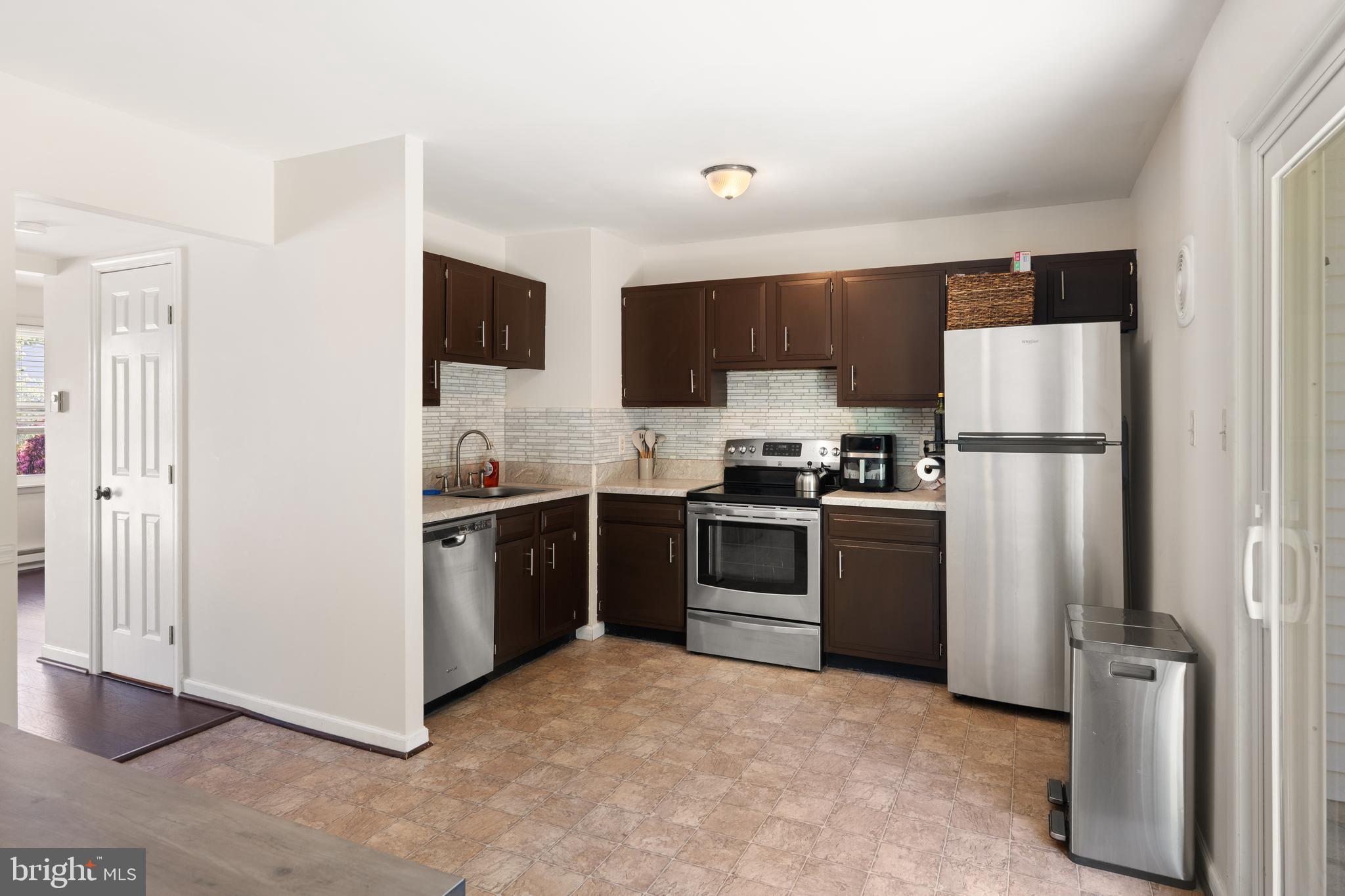 18 Wenner Drive Brunswick, MD 21716 - Photo 7 of 30 a kitchen with stainless steel appliances granite countertop a refrigerator sink and stove
