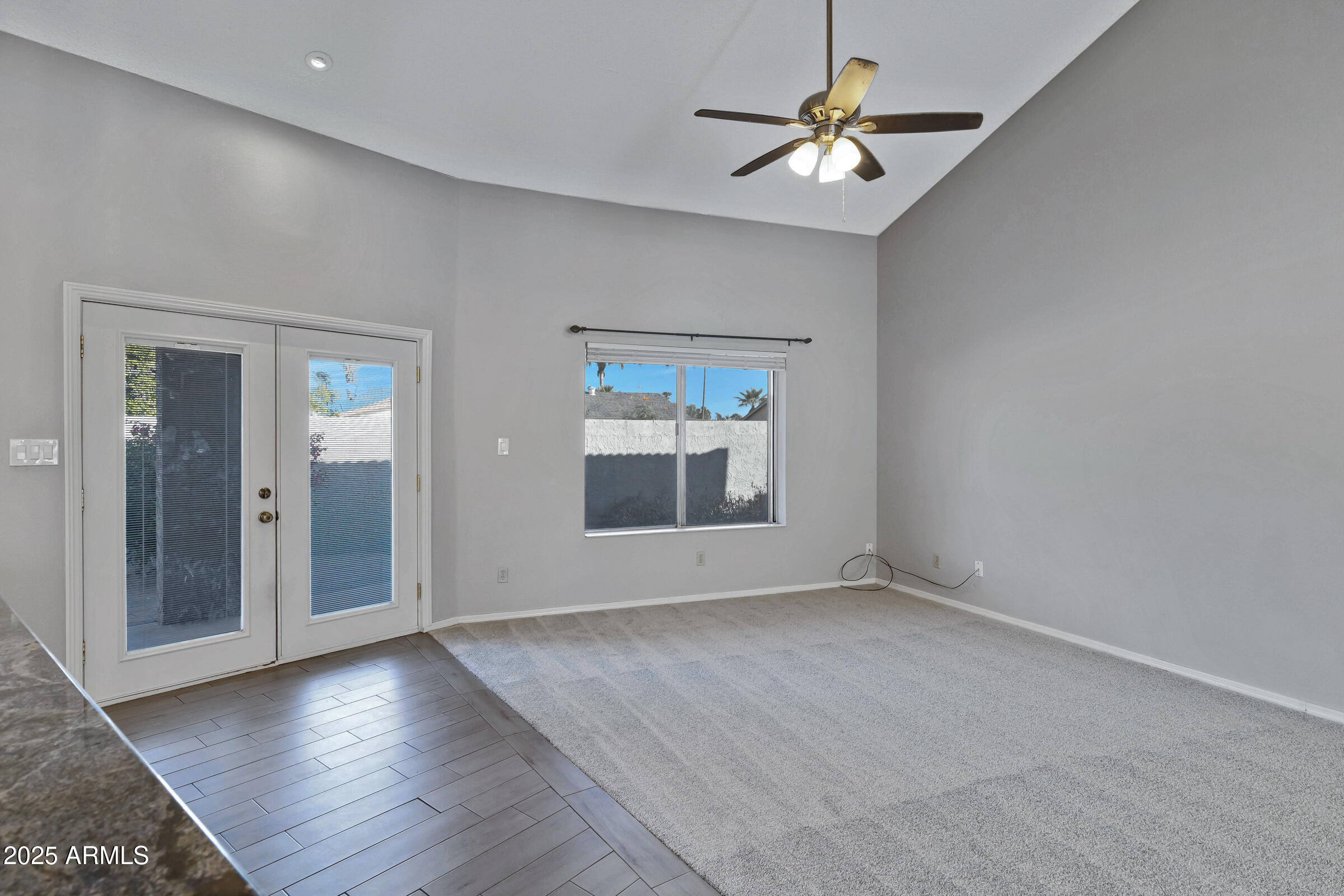 792 West El Monte Place, Unit 8 Chandler, AZ 85225 - Photo 12 of 33 wooden floor in an empty room with a window