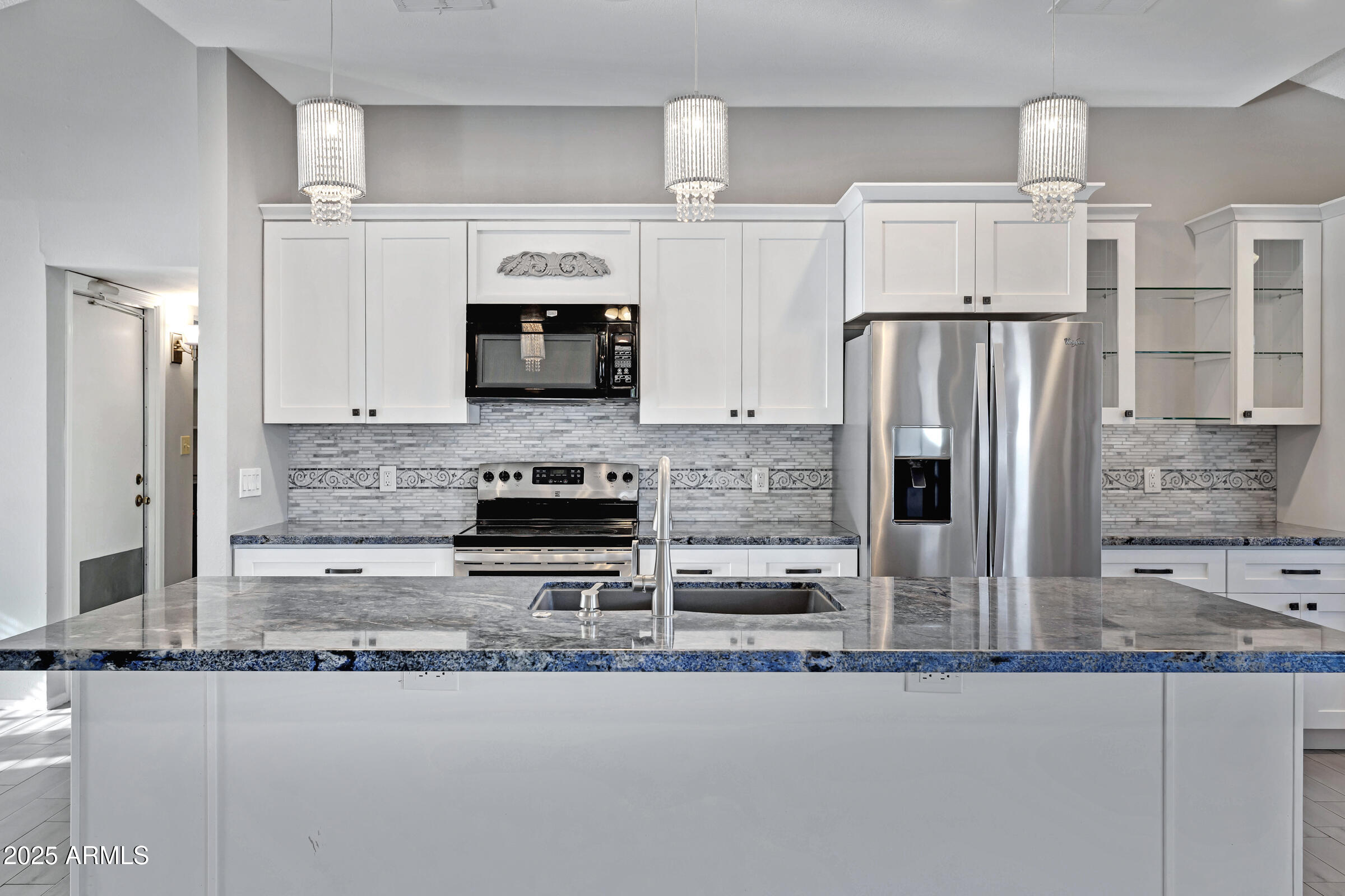 792 West El Monte Place, Unit 8 Chandler, AZ 85225 - Photo 13 of 33 a kitchen with stainless steel appliances granite countertop a refrigerator and a stove top oven