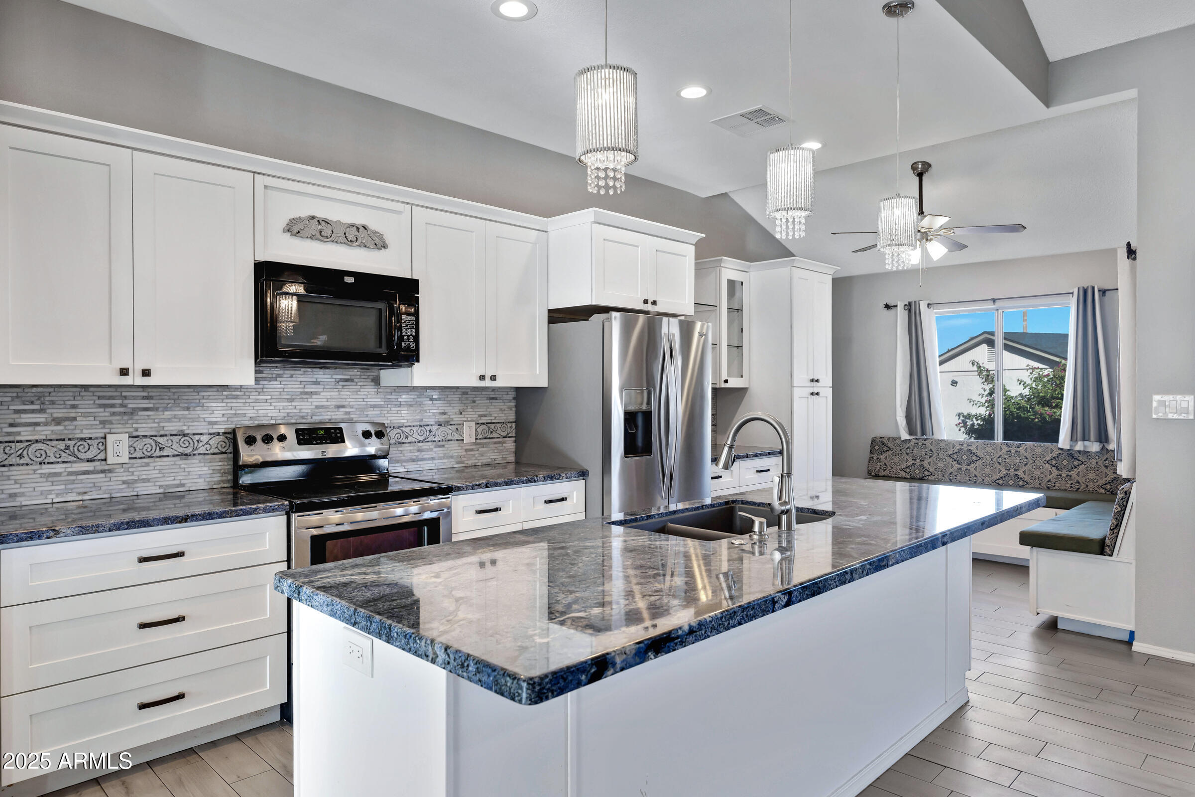 792 West El Monte Place, Unit 8 Chandler, AZ 85225 - Photo 14 of 33 a kitchen with stainless steel appliances granite countertop a sink refrigerator and cabinets