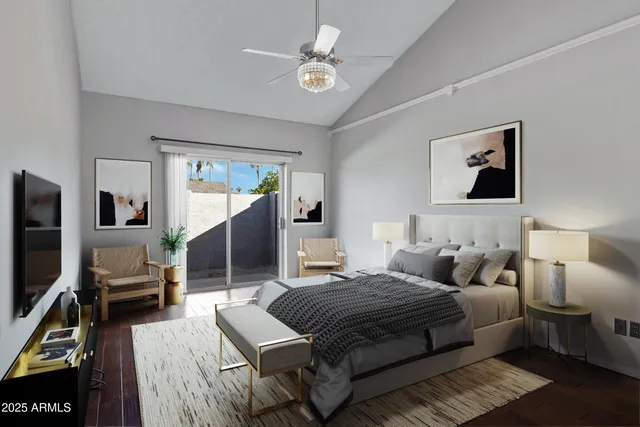 a bedroom with a bed couch and a window