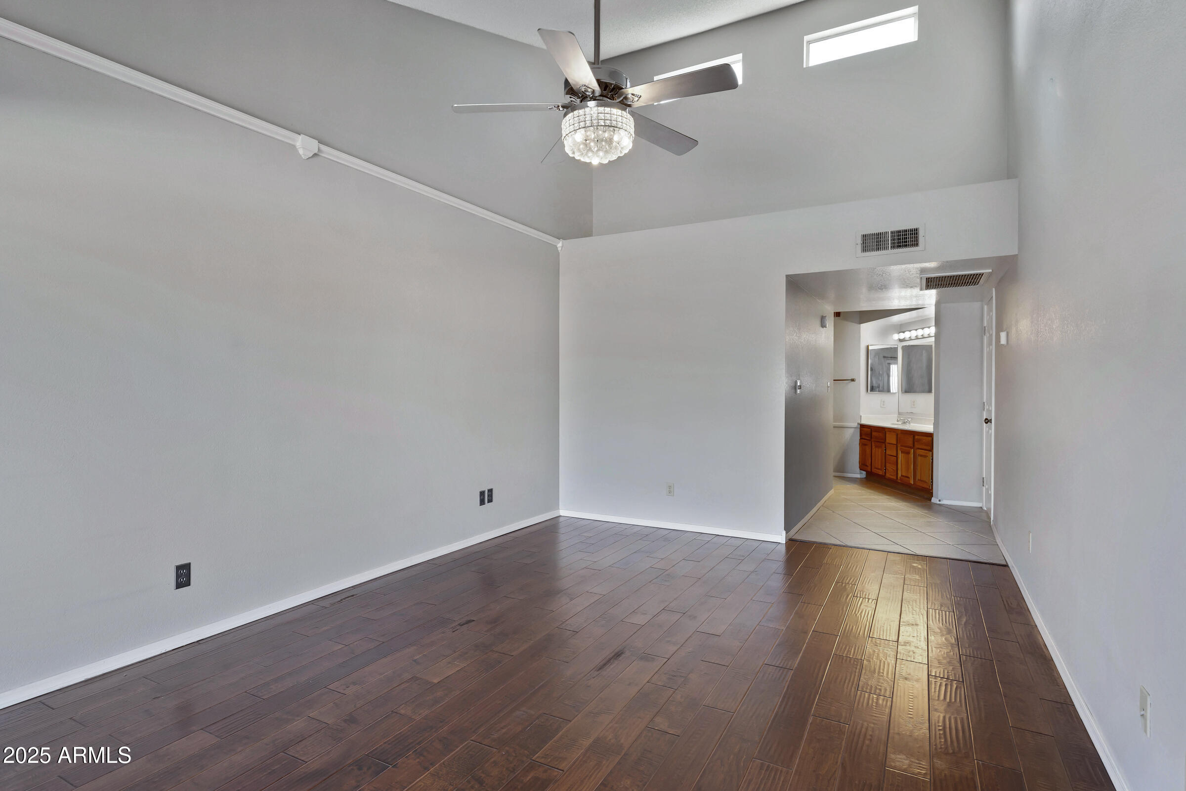 792 West El Monte Place, Unit 8 Chandler, AZ 85225 - Photo 25 of 33 wooden floor in an empty room with a window