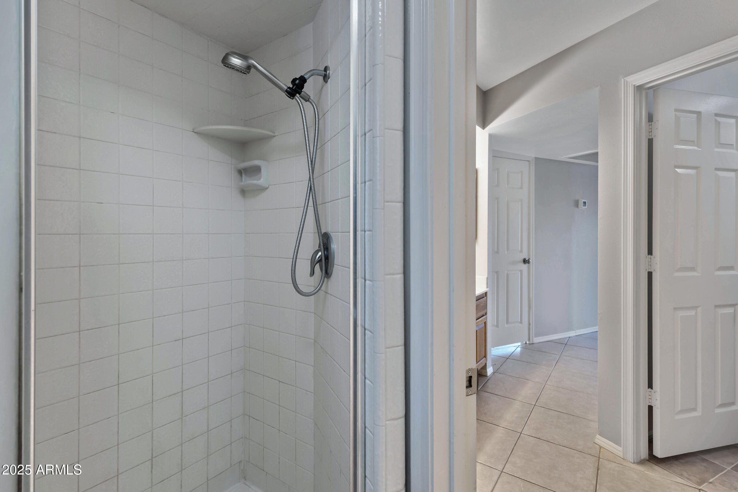 792 West El Monte Place, Unit 8 Chandler, AZ 85225 - Photo 28 of 33 a bathroom with a glass shower door