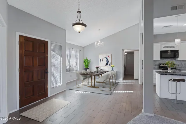 a view of a livingroom with furniture fire place and a window