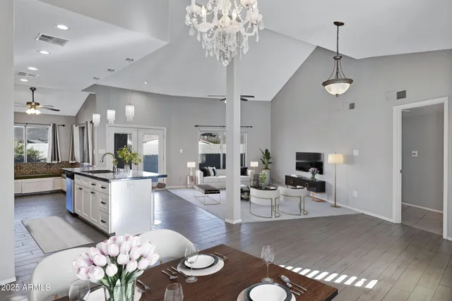 a large kitchen with a table and chairs