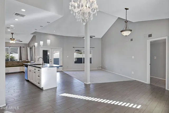 a view of a kitchen with sink microwave and stove