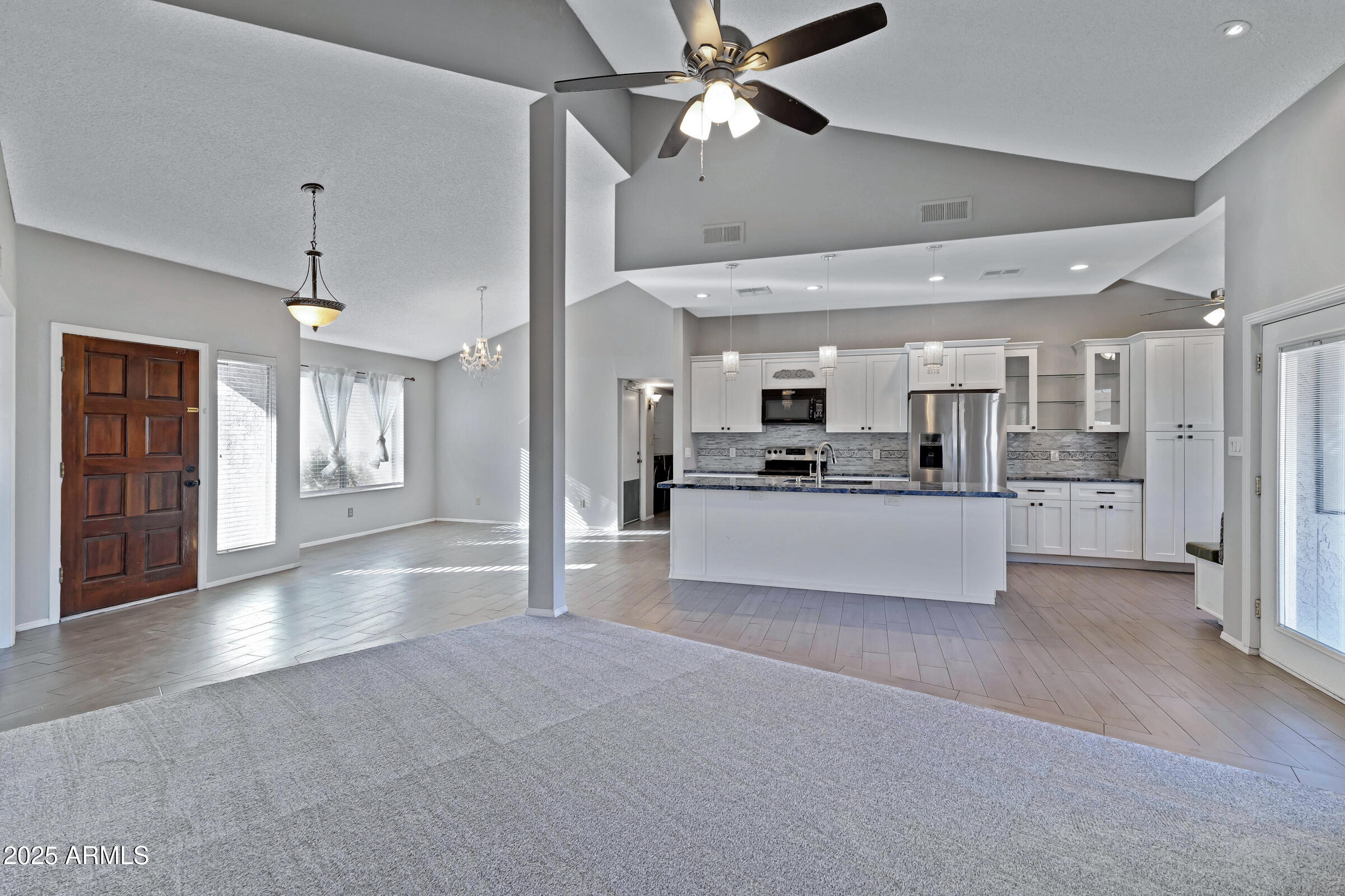 792 West El Monte Place, Unit 8 Chandler, AZ 85225 - Photo 9 of 33 a view of a kitchen with refrigerator and a stove top oven