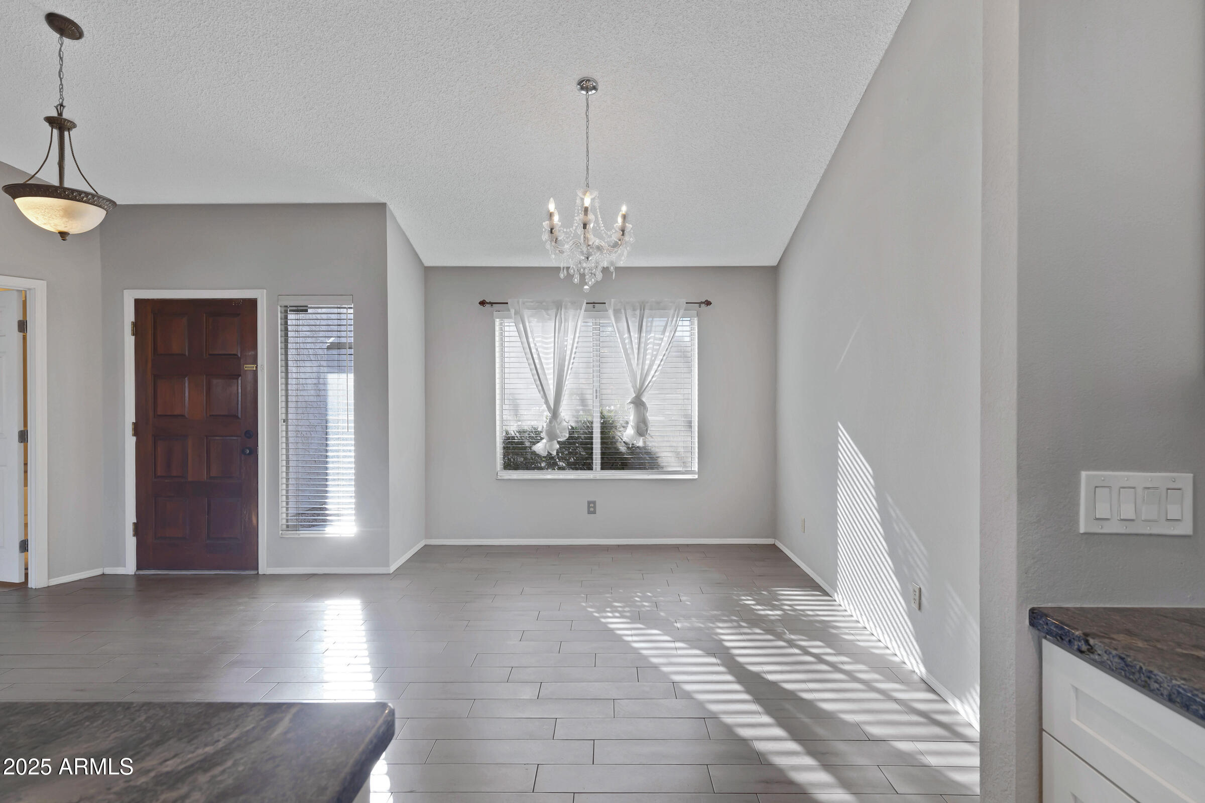 792 West El Monte Place, Unit 8 Chandler, AZ 85225 - Photo 10 of 33 a view of an empty room with a window