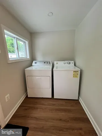 a view of a house with backyard and porch