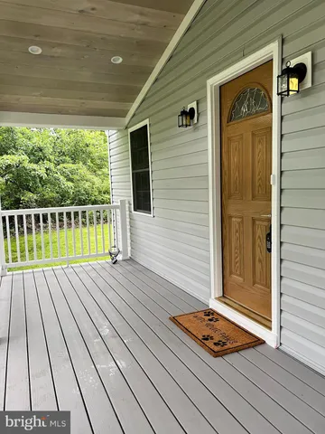 a view of a balcony with wooden floor