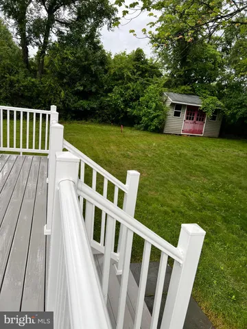 a view of deck with wooden floor and fence