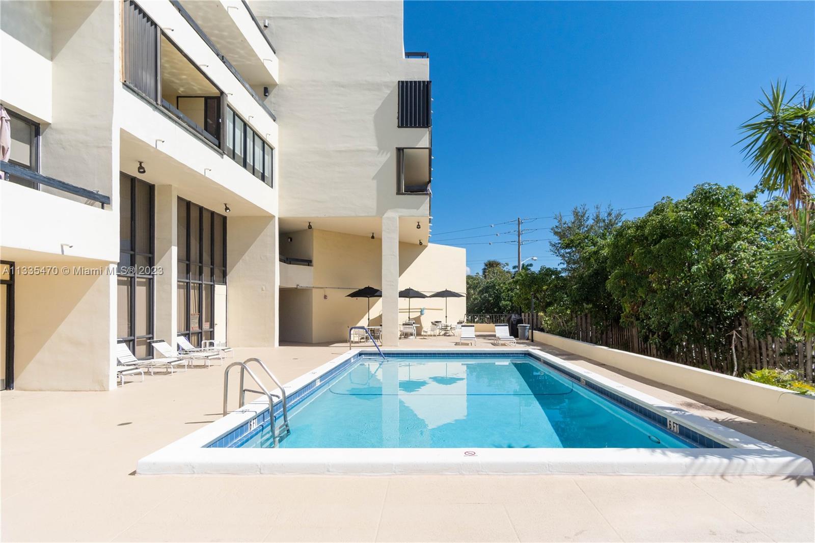 1401 South Federal Highway, Unit 204 Boca Raton, FL 33432 - Photo 17 of 22 a view of a swimming pool with an outdoor space