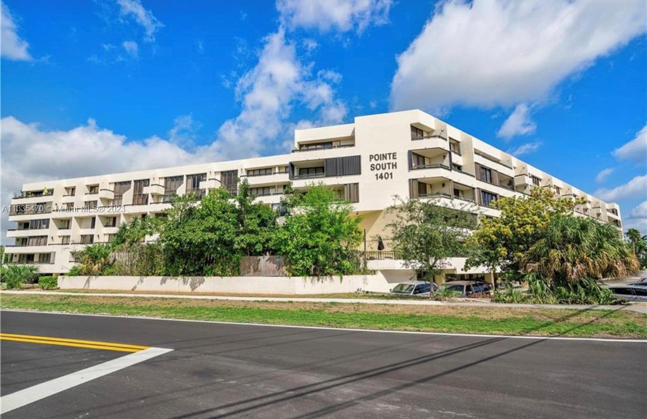 1401 South Federal Highway, Unit 204 Boca Raton, FL 33432 - Photo 22 of 22 a view of a tall building next to a yard