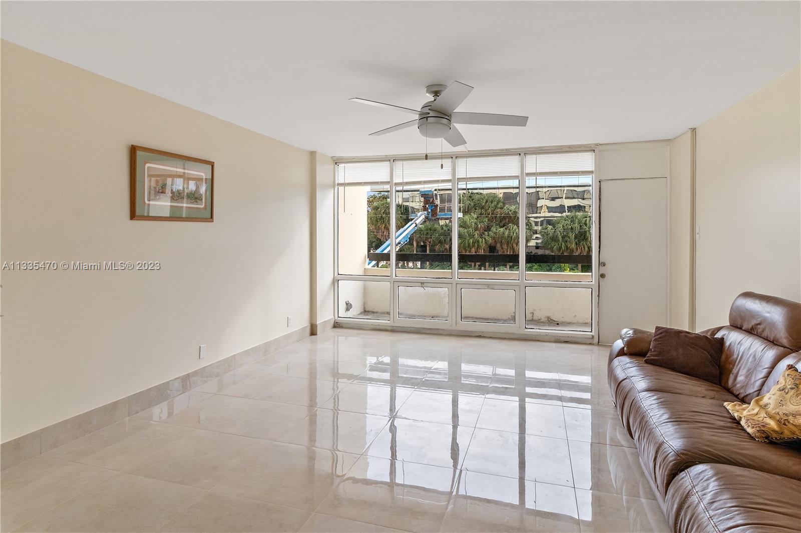 1401 South Federal Highway, Unit 204 Boca Raton, FL 33432 - Photo 5 of 22 a living room with furniture and a large window