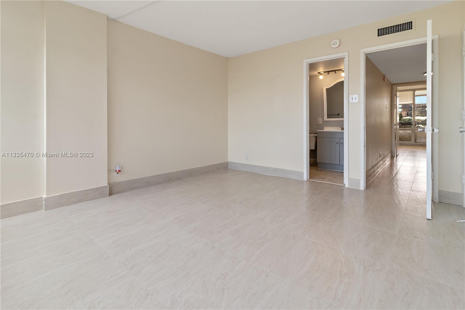 1401 South Federal Highway, Unit 204 Boca Raton, FL 33432 - Photo 9 of 22 an empty room with closet and a hallway