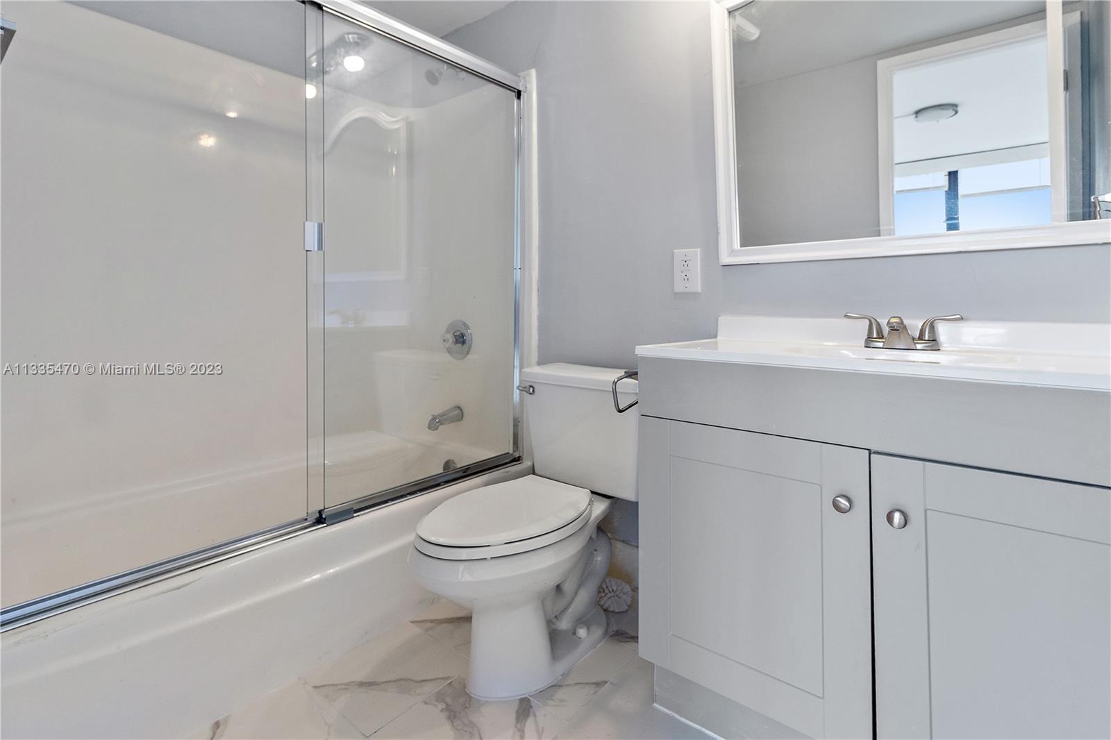 1401 South Federal Highway, Unit 204 Boca Raton, FL 33432 - Photo 10 of 22 a bathroom with a sink a toilet and shower