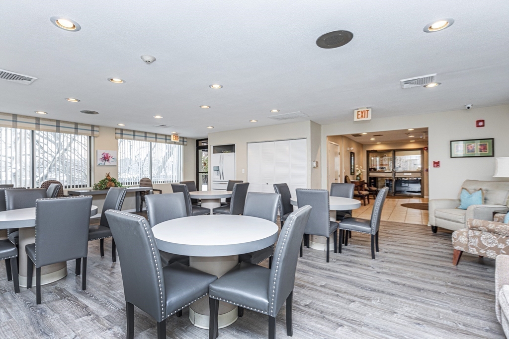 1002 Paradise Road, Unit 1M Swampscott, MA 01907 - Photo 21 of 25 a view of a dining room with furniture