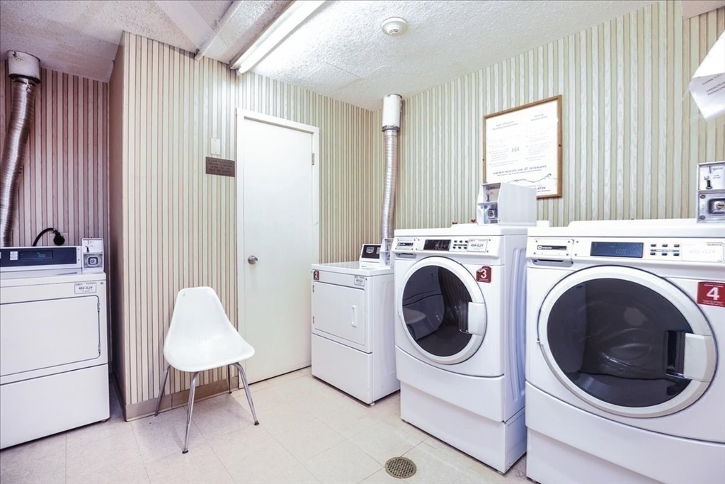 1002 Paradise Road, Unit 1M Swampscott, MA 01907 - Photo 25 of 25 a utility room with dryer and washer