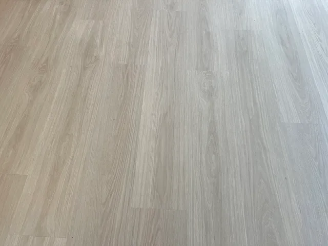 a kitchen with a refrigerator and a stove