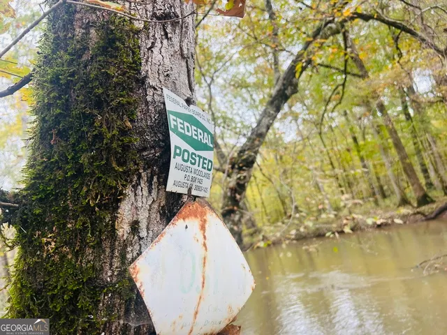 a picture of a glass window with a white wall and a large window