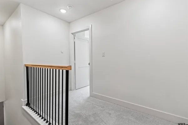 a view of a room with a wooden floor