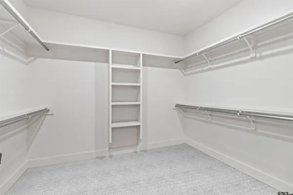 a view of an empty walk in closet