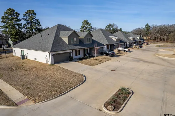 a view of a house with a snow on the road
