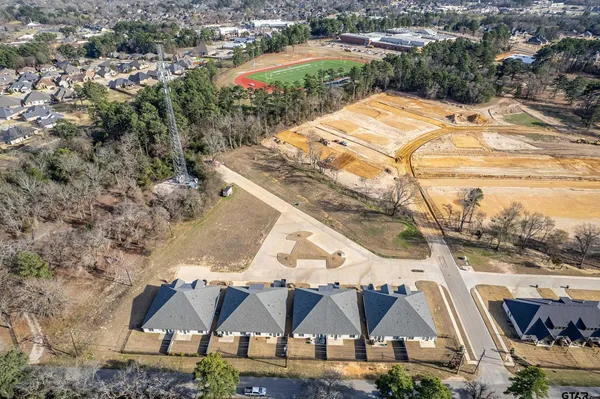 a living room with white cabinets and black appliances