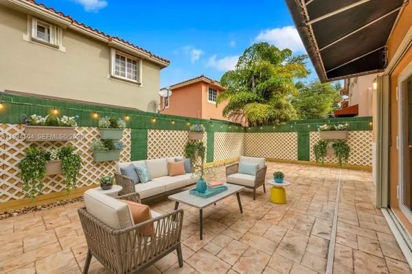 a building outdoor space with patio furniture