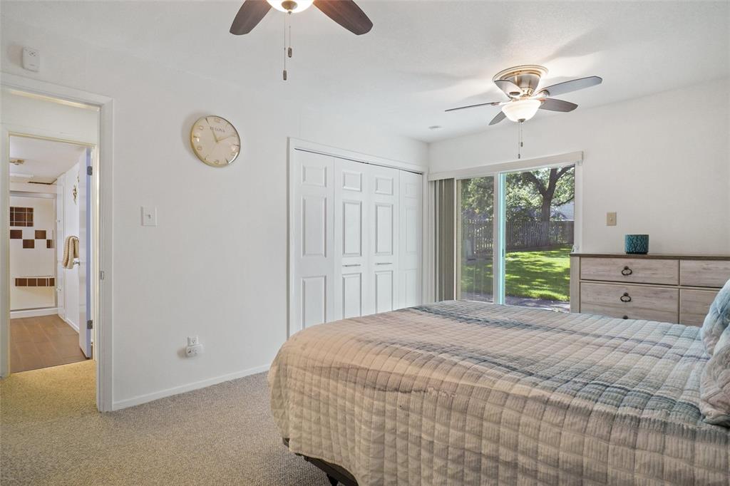 388 Driftwood Court, Unit 1A Azle, TX 76020 - Photo 14 of 29 Primary with sliding glass door and a perfect little patio