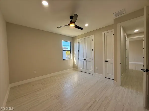 a view of an empty room and glass door