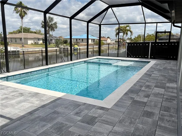 a swimming pool with a outdoor seating