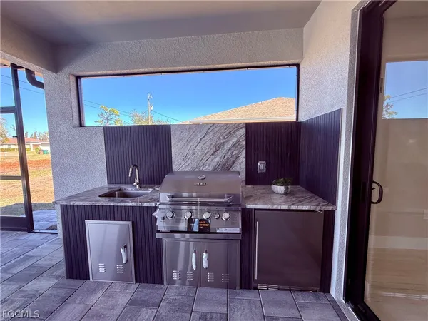a kitchen with a stove and a wooden cabinets