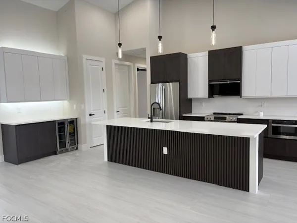 a kitchen with a sink and a stove