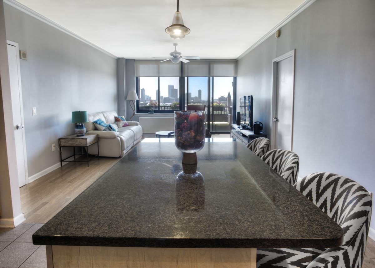 700 Grove Street, Unit 12J Jersey City, NJ 07310 - Photo 6 of 16 a living room with dining table