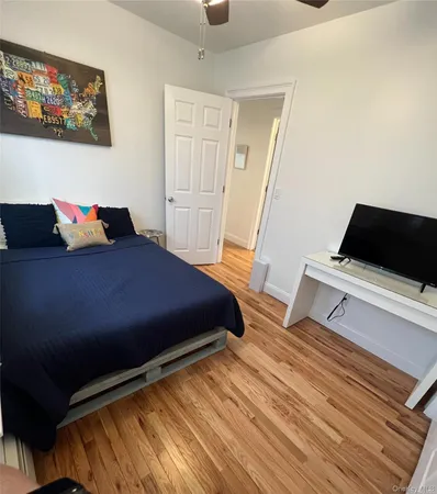 a bedroom with a bed and a desk