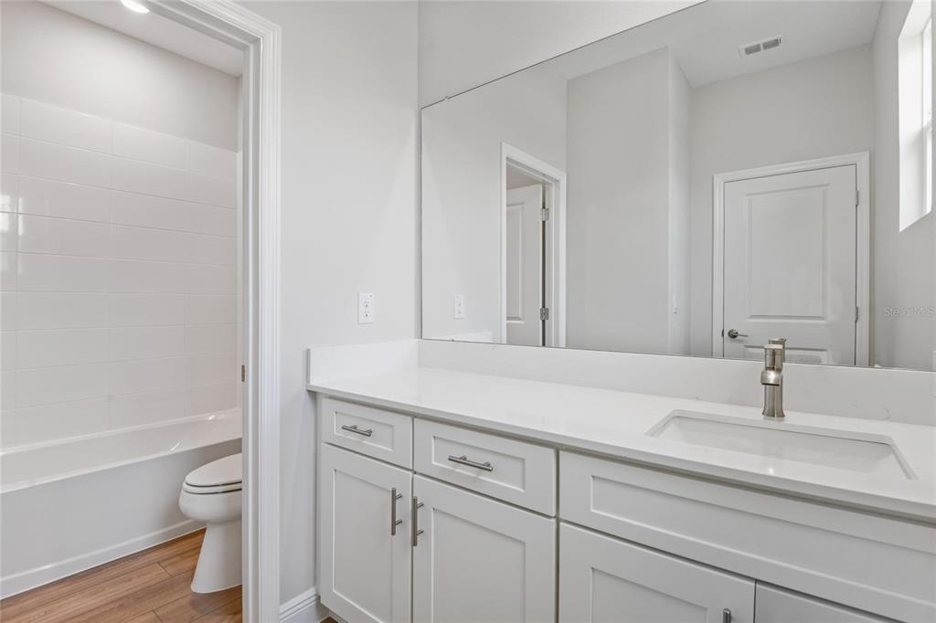 6236 Southwest 97th Street Ocala, FL 34476 - Photo 17 of 31 a bathroom with a sink a toilet and a bathtub