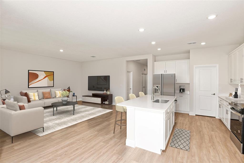 6236 Southwest 97th Street Ocala, FL 34476 - Photo 19 of 31 a living room with stainless steel appliances furniture a flat screen tv and a table