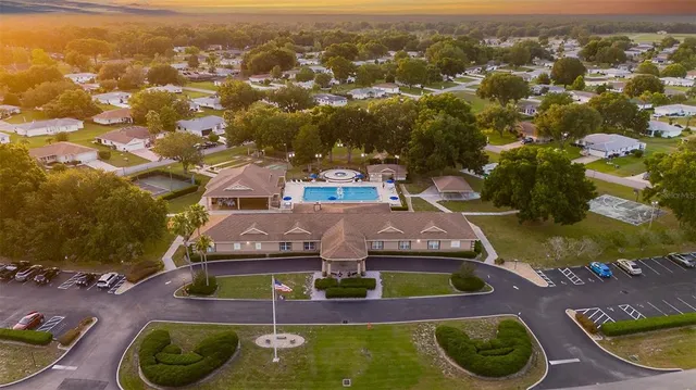an aerial view of a house with yard swimming pool and outdoor space
