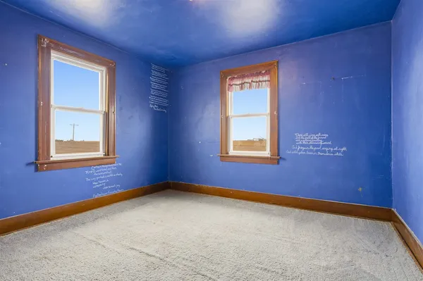 an empty room with windows