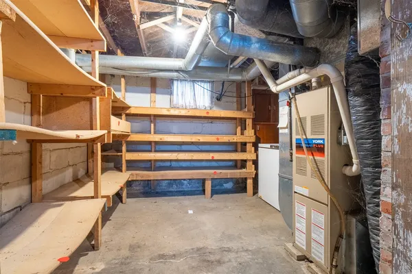 a view of an empty room with a staircase