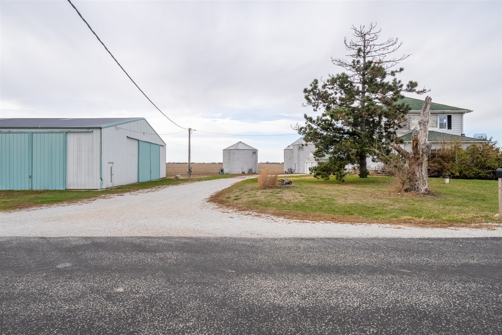 28234 North 1600 East Road Gridley, IL 61744 - Photo 3 of 31 a view of a house with a yard and garage