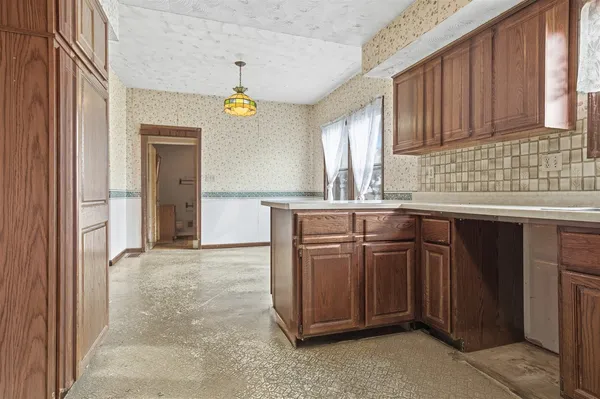 a kitchen with a sink and cabinets