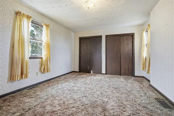 an empty room with windows
